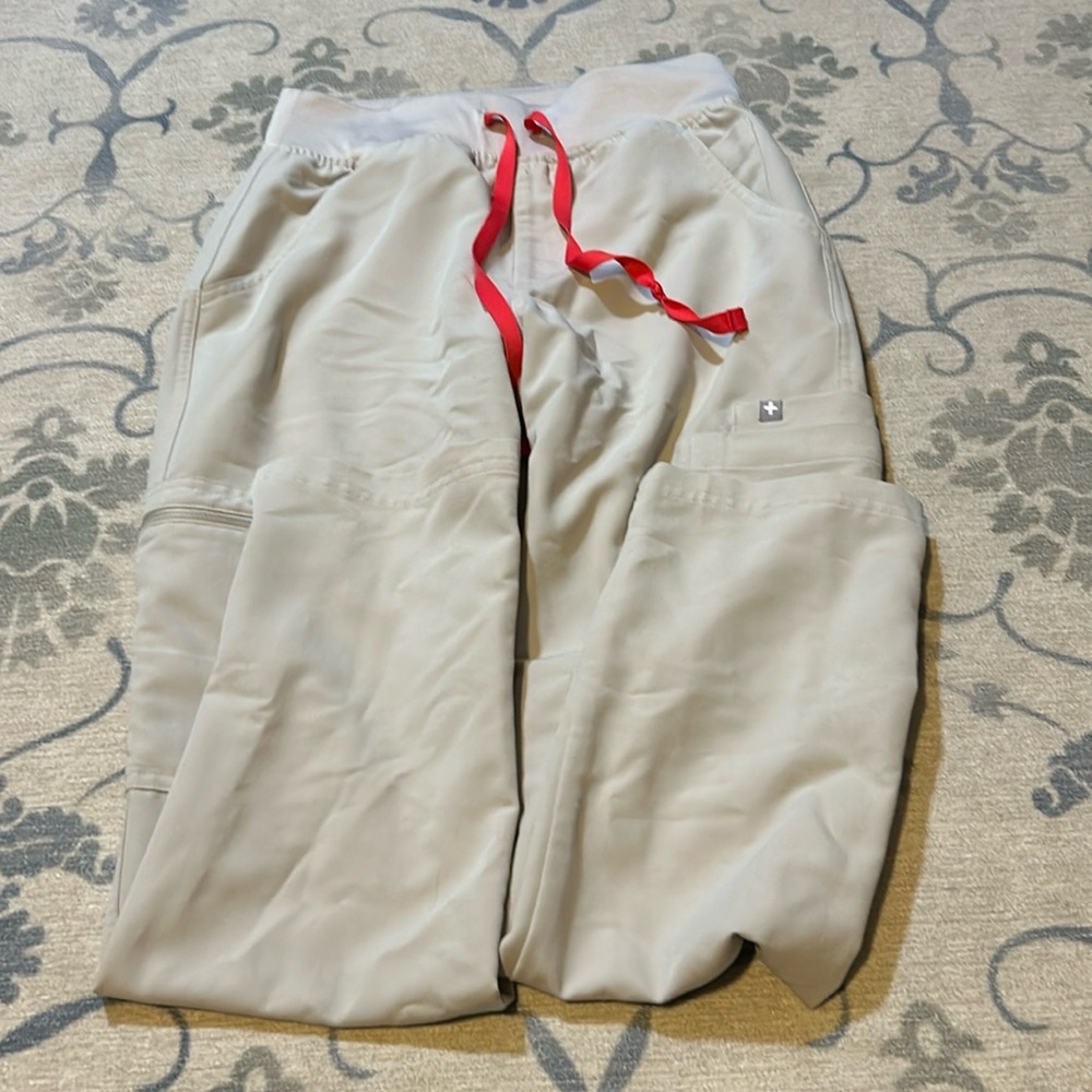 Figs scrubs in bone bottoms are XS petite and top is XS not worn a lot